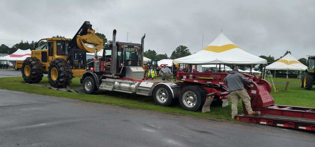Exhibitors move their equipment into place